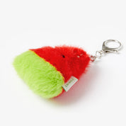 Watermelon-shaped keychain on a white background