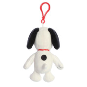 Plush Snoopy bag charm with a red clip on a white background