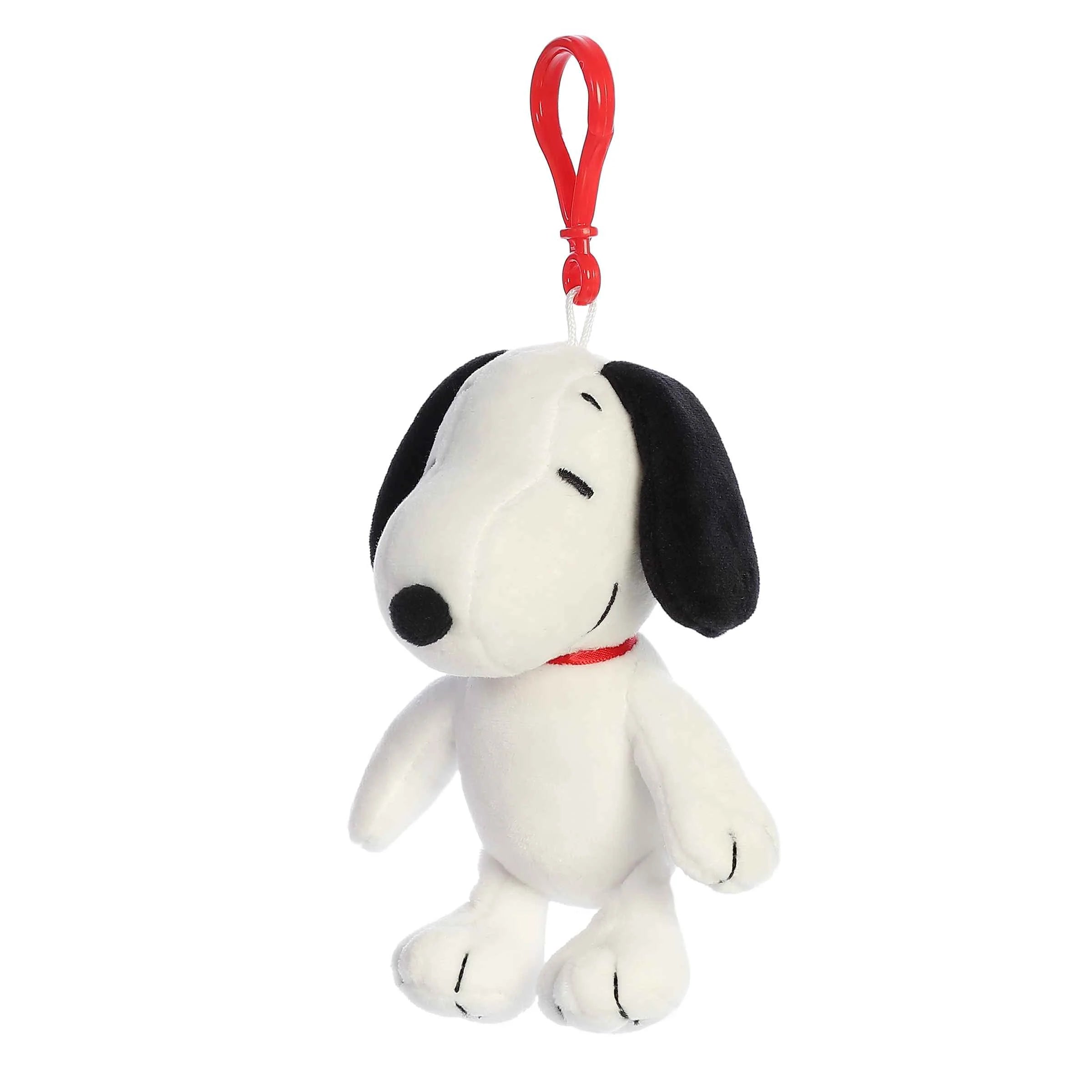 Plush Snoopy bag charm with a red clip on a white background