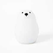 White ceramic bear-shaped object on a white background