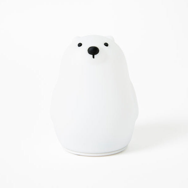 White ceramic bear-shaped object on a white background