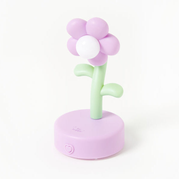 Pastel-colored flower-shaped night light on a white background