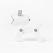 White dog-shaped night light on a white background