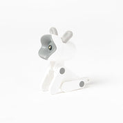 White and gray dog-shaped night light on a white background