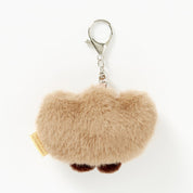 Fuzzy brown keychain with a clip on a white background