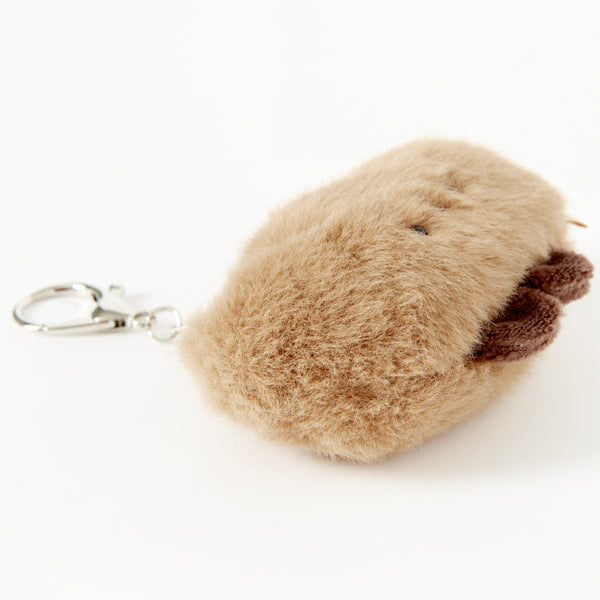 Brown fluffy keychain on a white background