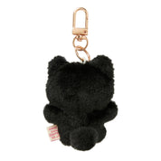 Black fluffy keychain with a gold clasp on a white background