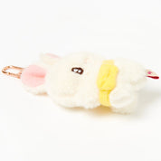 Plush toy shaped like a bird with a pink beak on a white background