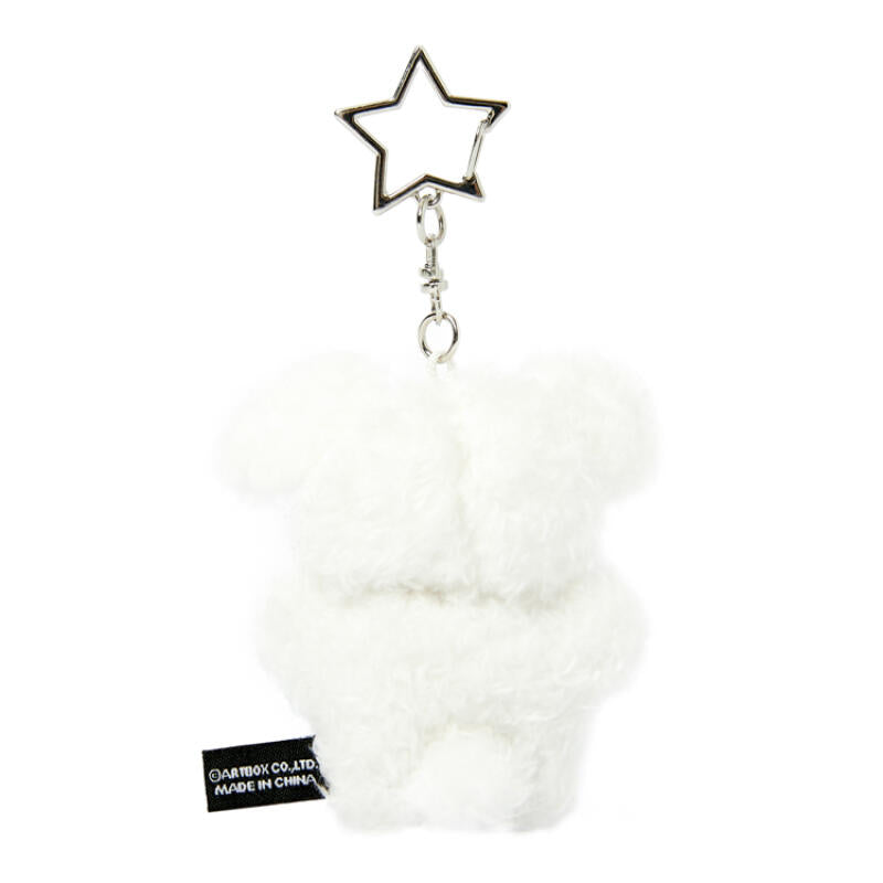 White fluffy keychain with a star-shaped charm on a white background