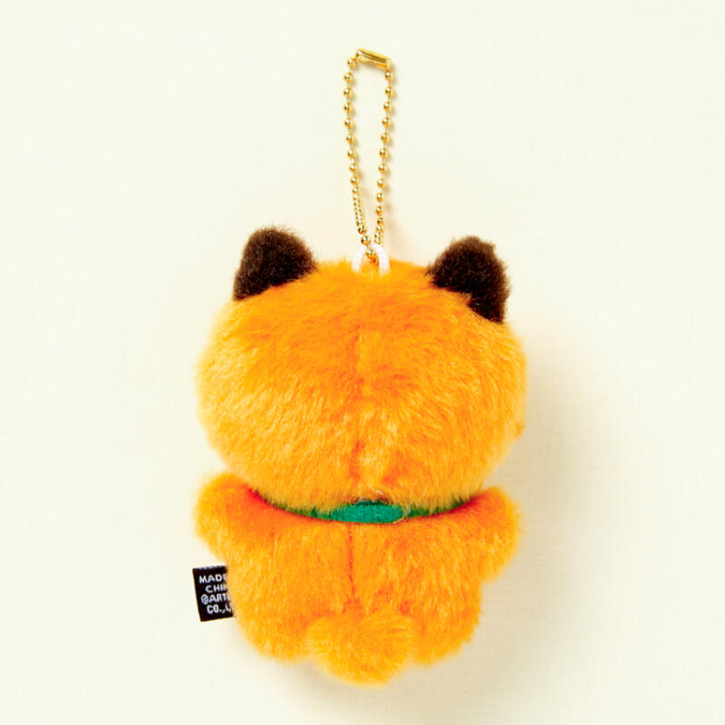 Plush keychain shaped like a cat with orange fur and black ears on a white background