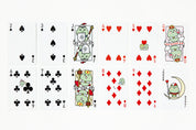 Playing cards with cartoon frog characters on a white background