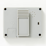 White electronic device with buttons and ports on a white background