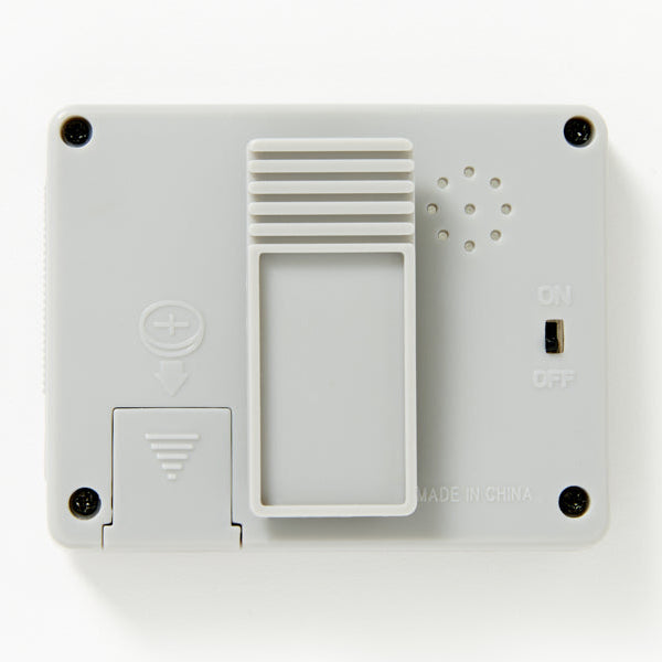 White electronic device with buttons and ports on a white background