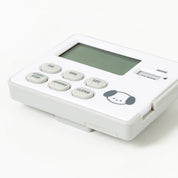 White electronic device with digital display and buttons on a white background