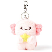 Plush keychain with a pink creature holding a yellow star on a white background